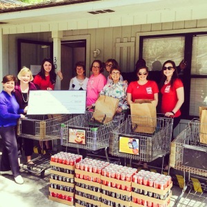 Pictured from left to right are Pam Rice of Our Lady’s Pantry, Representative Shannon Erickson, Emilie Nicholls, Our Lady’s Pantry volunteers and Coca-Cola staff (in red).