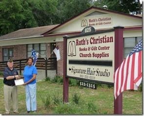 American Legion Beaufort Post 9, a new member of the Beaufort Chamber of Commerce, is striving to promote both patriotism and successful business in the Beaufort area. It is calling attention to local businesses that proudly display the U.S. flag at their location. Post 9 presents those enterprises with a framed certificate thanking them. Here, Michelle Ladd, of Ruth’s Christian Books & Gifts Center, accepts the certificate from Post Commander Chuck Lurey.