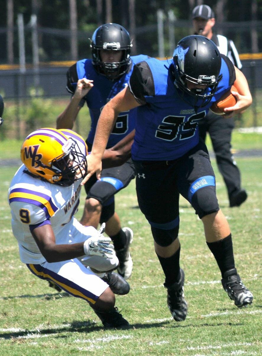 Newly opened May River High School dropped its home opener against Whale Branch Early College High School, 41-7, on Saturday, Sept. 3. May River dropped to 0-3. The Sharks will travel to Heritage Academy for a non-conference game at 7 p.m. Friday, Sept. 9. Whale Branch’s Warriors improved to 1-1 but face the Beaufort High Eagles (2-1) Sept. 9 at Eagle Stadium on Lady’s Island. Game time is 7:30 p.m. Photo by Bob Sofaly.
