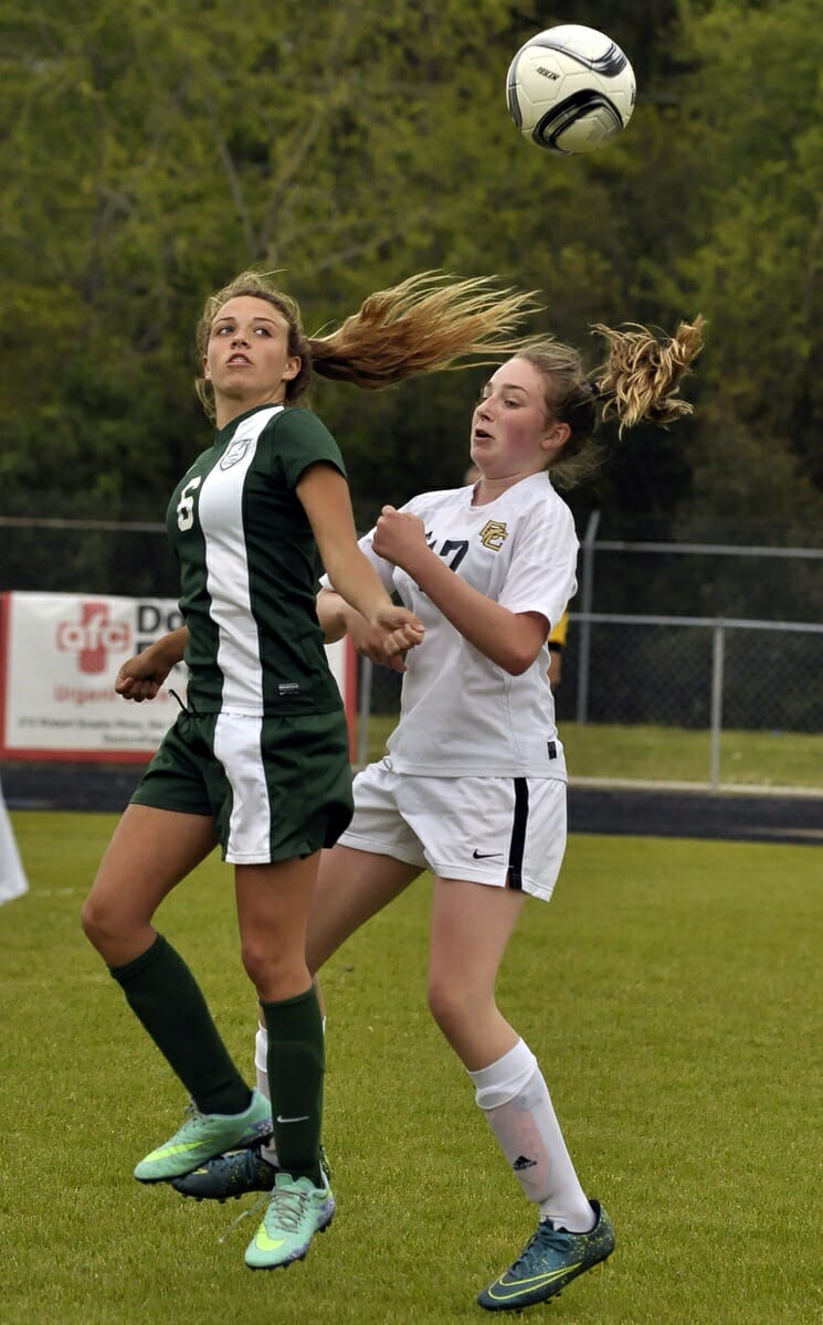 Battery Creek and Bishop England girl’s soccer players battle for control of the ball.