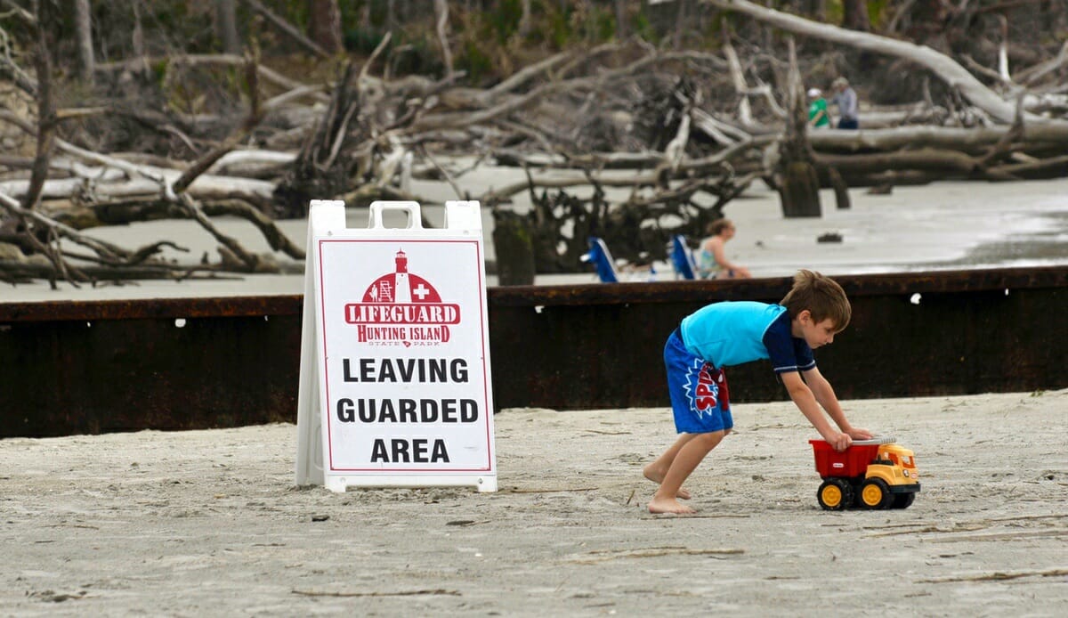 An unidentified boy pushes his toy truck near one of the groins along the beach at Hunting Island State Park. The park suffered major damage recently from Hurricane Matthew.