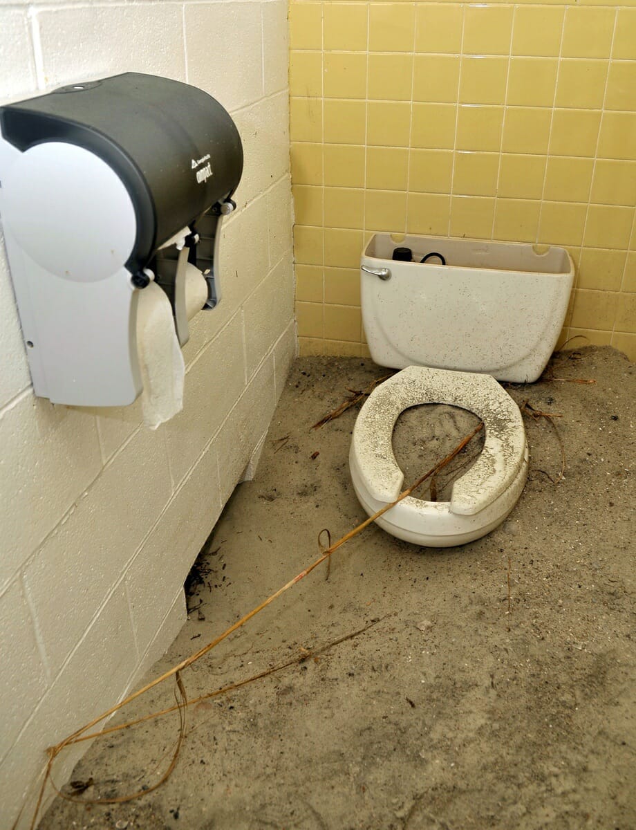 A toilet filled with sand shows how extensive the damage done to the state park’s waste disposal system. The entire system needs to replaced.