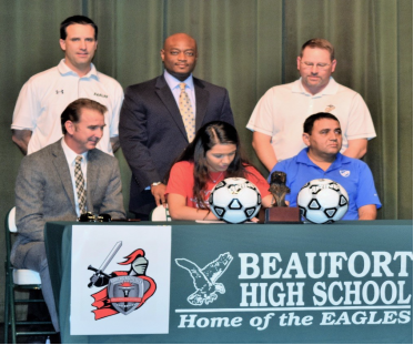Heily Hernandez and Omar Cummings signed National Letters of Intent last week. The Beaufort High School student-athletes were joined by friends and family in a signing ceremony held at Beaufort High School. Hernandez signed to play soccer for North Greenville University. Photo courtesy of Beaufort High School.