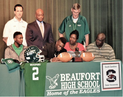 Omar Cummings signs to play football for South Carolina State University. Photo courtesy of Beaufort High School.