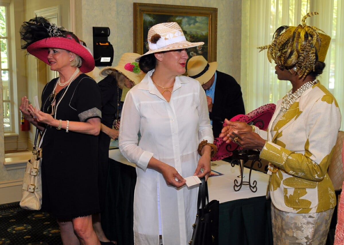 Members of the Beaufort History Museum show off their differing styles of hats during the spring tea.
