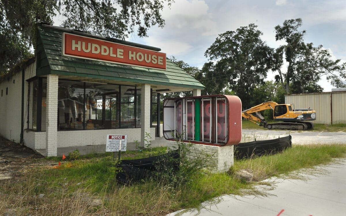 The old Huddle House on Boundary Street was gutted and demolished. The building at far right is one of the old fire stations for the Burton Fire District, which was razed as well.