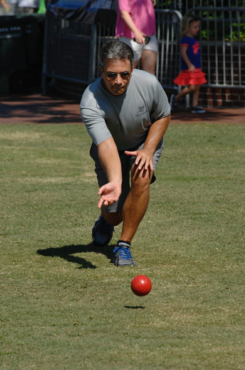 Greg Maniocourt launches his bocce ball during a close match July 15 during the annual Bocce Ball Tournament at Henry C. Chambers Waterfront Park. Maniocourt and teammate Nick Hunt won the tournament. It was their sixth victory in the Water Festival Bocce Ball Tournament.