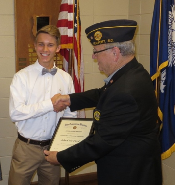 Post 9 Commander Chuck Lurey presents John Cole Floyd, a 2017 graduate of the Community Bible Church Christian Academy, with his educational scholarship. Floyd will be attending North Greenville University.