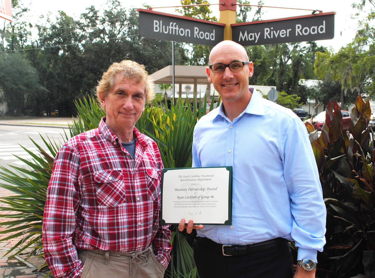 Ryan Lockhart, president of group46, was named Employer of the Year by the SC Vocational Rehabilitation Department. He is shown here with David Russell, who worked as a graphic designer at the company.