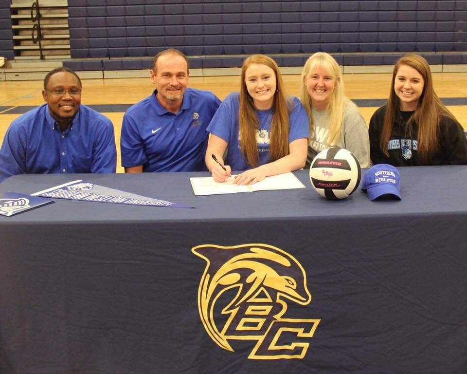 Battery Creek High School senior Mia DeBardelaben, center, has signed to play volleyball for Southern Wesleyan University. Photo courtesy of Battery Creek High School.