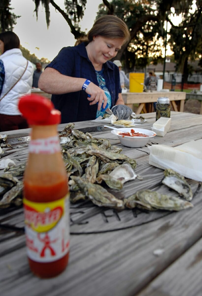 Paige McKenzie spent her birthday on Nov. 4 attending her first oyster roast. Here, she timidly cuts into an oyster during the event.