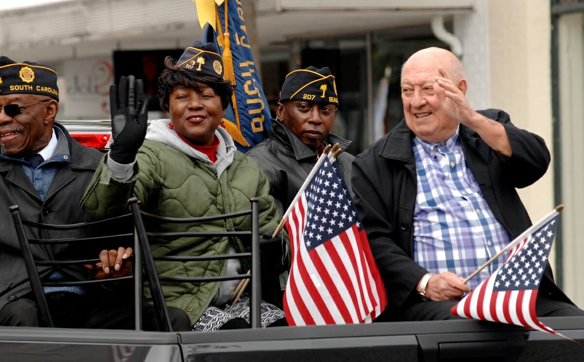 Members of VFW Post 207 wave to the crowd